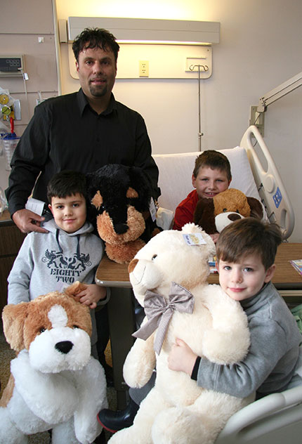 George Lou Karmiris in hospital with kids.
